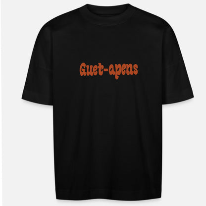 T-shirt oversize noir avec le nom de la marque Guet-apens en orange sur le devant.